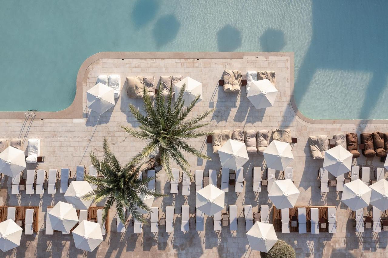 Helea Lifestyle Beach Resort Kallithea  ภายนอก รูปภาพ Aerial view of the pool at the Westin Dubai